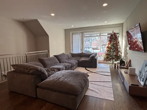 Dark gray cloud couch in customer's home
